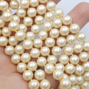 Collana Trifari fine degli anni '50, due fili di perle della stessa consistenza delle perle vere, chiusura in lega Trifanium color oro con mezza perla centrale - VINTAGE AMORE MIO