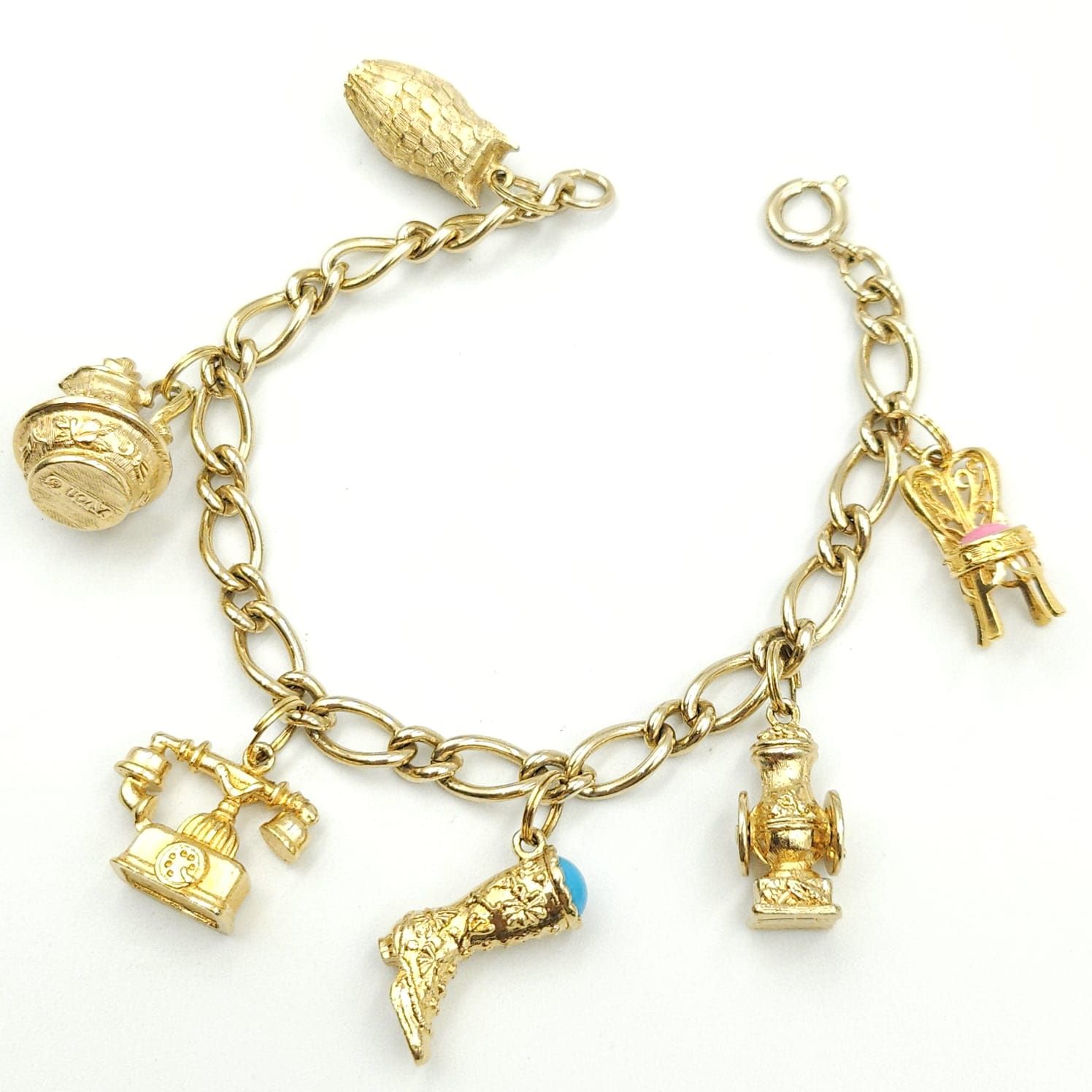 Braccialetto charms anni '60 firmato Avon, con ciondoli di vari soggetti, metallo color oro - VINTAGE AMORE MIO