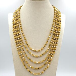 Parure Trifari della serie Electra realizzata nella seconda metà degli anni '50, composta da collana e bracciale, entrambi a cinque fili di pepite di lega Trifanium color oro - VINTAGE AMORE MIO