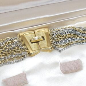 Collana multicatena firmata Trifari risalente al 1960 circa, composta da catene di lega Trifanium color oro e argento, chiusura in lega Trifanium color oro satinato - VINTAGE AMORE MIO