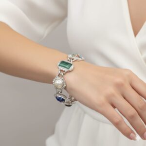 Bracciale anni '60 firmato Sarah Coventry, realizzato in metallo color argento con cabochons marmorizzati di vari colori e forme - VINTAGE AMORE MIO