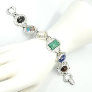 Bracciale anni '60 firmato Sarah Coventry, realizzato in metallo color argento con cabochons marmorizzati di vari colori e forme - VINTAGE AMORE MIO