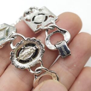 Bracciale anni '60 firmato Sarah Coventry, realizzato in metallo color argento con cabochons marmorizzati di vari colori e forme - VINTAGE AMORE MIO