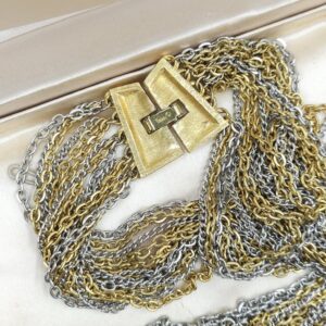 Collana multicatena firmata Trifari risalente al 1960 circa, composta da catene di lega Trifanium color oro e argento, chiusura in lega Trifanium color oro satinato - VINTAGE AMORE MIO
