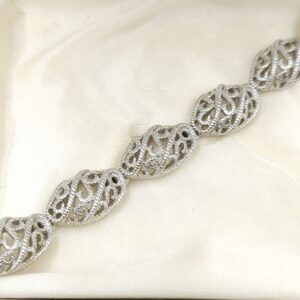 Braccialetto firmato Trifari realizzato verso il 1960 in lega Trifanium color argento con lavorazione a cordoncino - VINTAGE AMORE MIO Braccialetto firmato Trifari realizzato verso il 1960 in lega Trifanium color argento con lavorazione a cordoncino - VINTAGE AMORE MIO