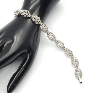 Braccialetto firmato Trifari realizzato verso il 1960 in lega Trifanium color argento con lavorazione a cordoncino - VINTAGE AMORE MIO Braccialetto firmato Trifari realizzato verso il 1960 in lega Trifanium color argento con lavorazione a cordoncino - VINTAGE AMORE MIO